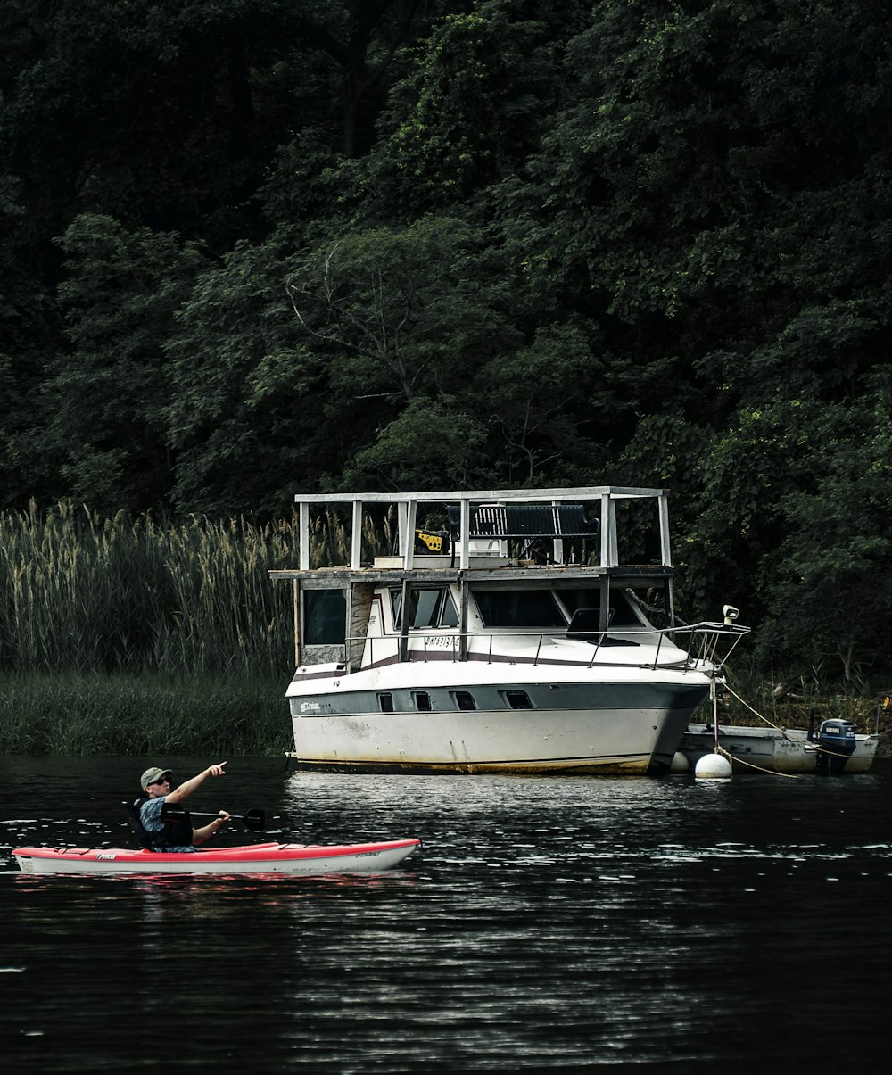 white and red boat on river during daytime