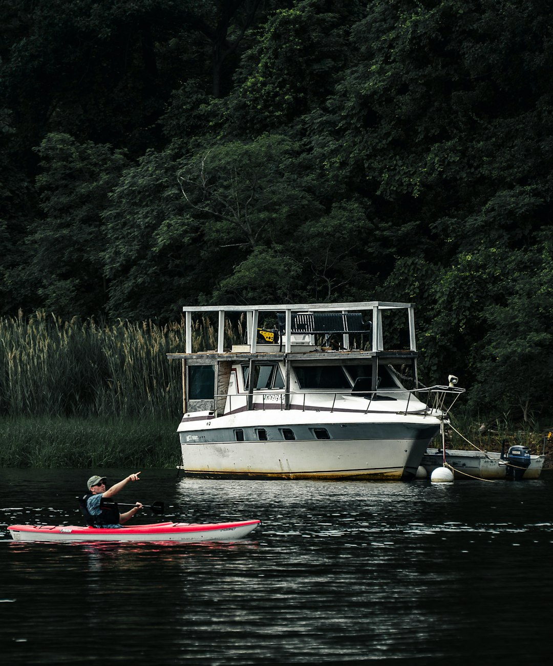 white and red boat on river during daytime