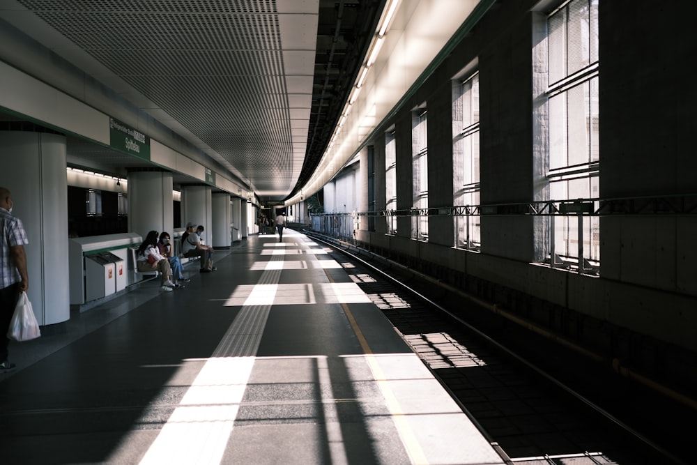 people walking on train station during daytime