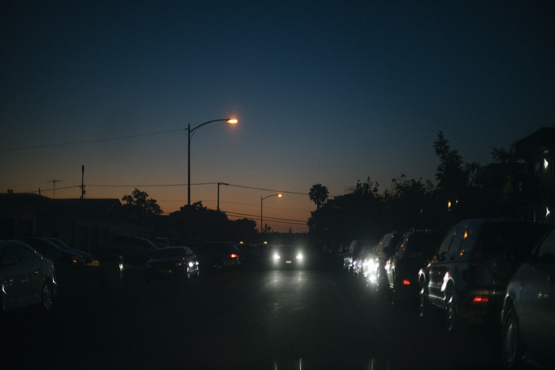 cars parked on parking lot during night time