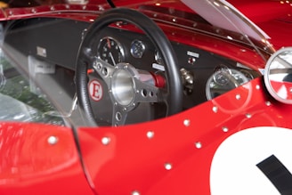 Close-up of a limited edition card featuring a famous athlete, with a car dashboard in the background.