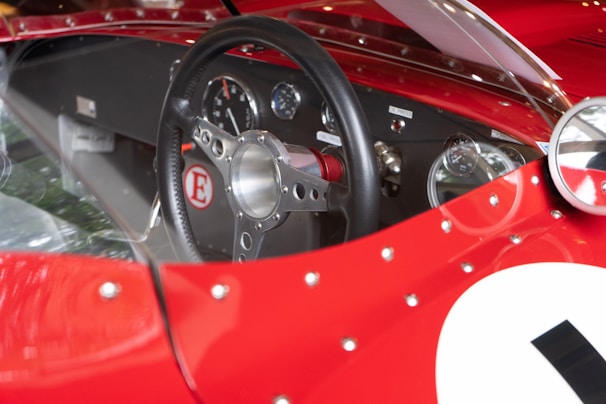 Close-up of a limited edition card featuring a famous athlete, with a car dashboard in the background.