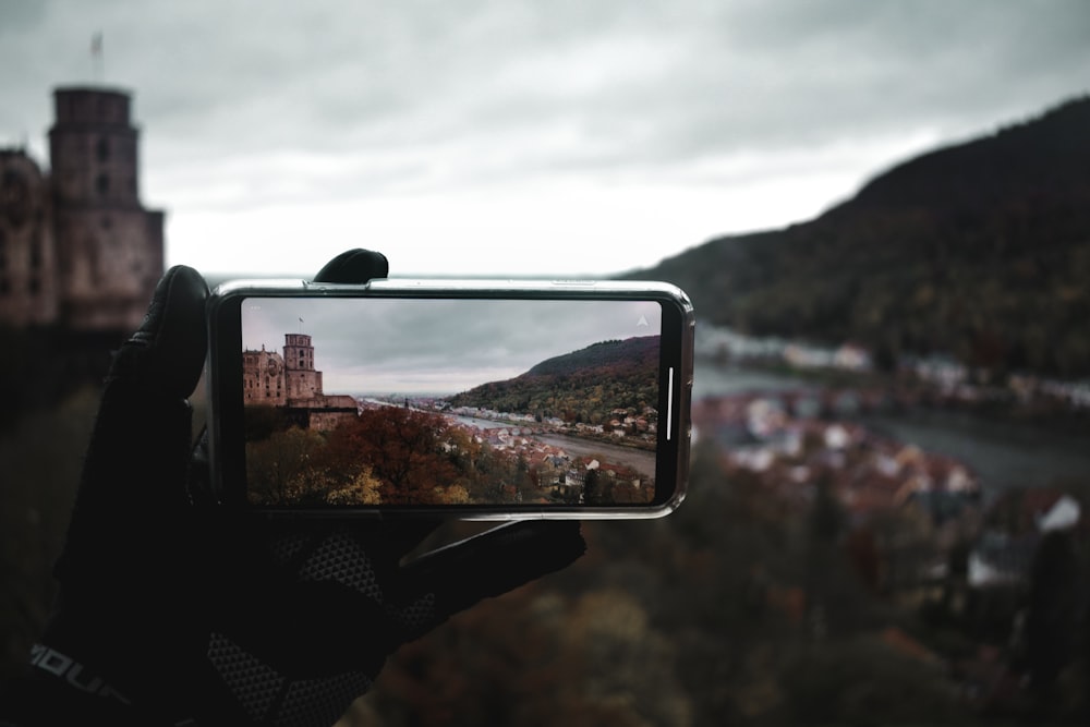 black smartphone taking photo of mountain during daytime