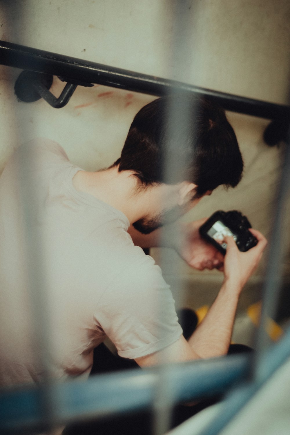 a man holding a cell phone up to his face