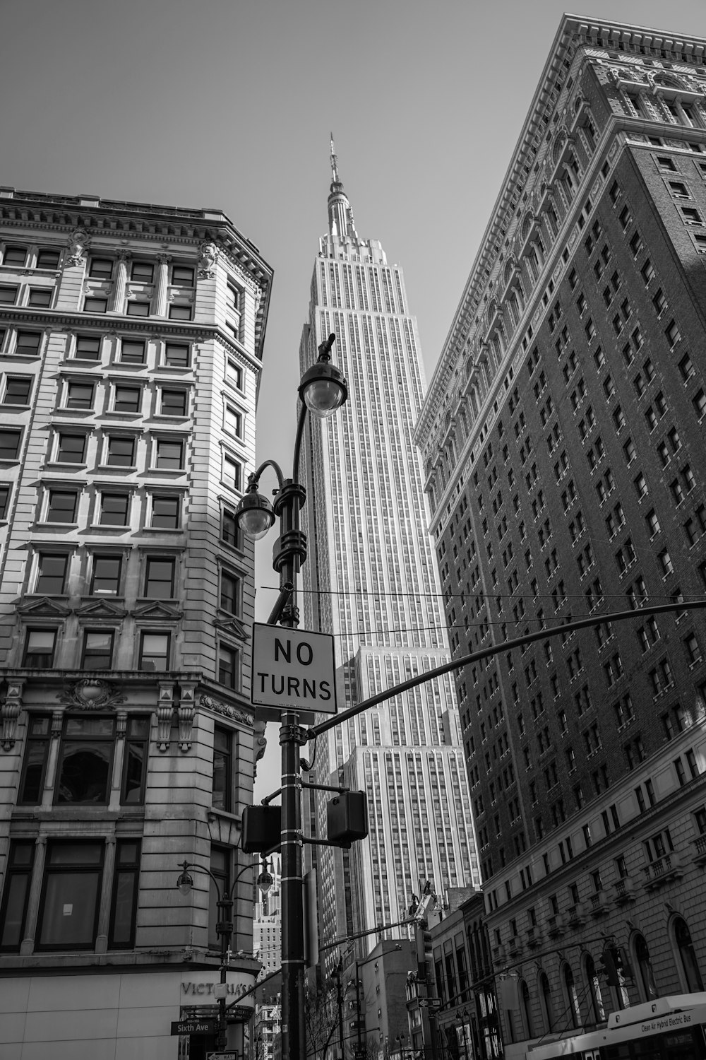 grayscale photo of man riding on horse statue