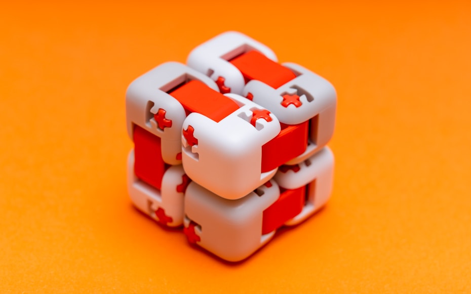 white plastic toy on orange surface