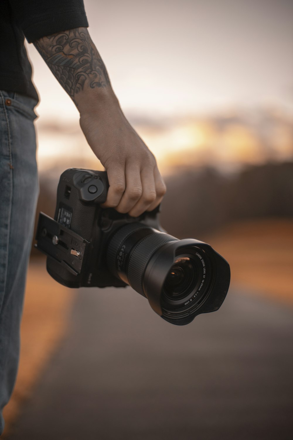 person holding black dslr camera