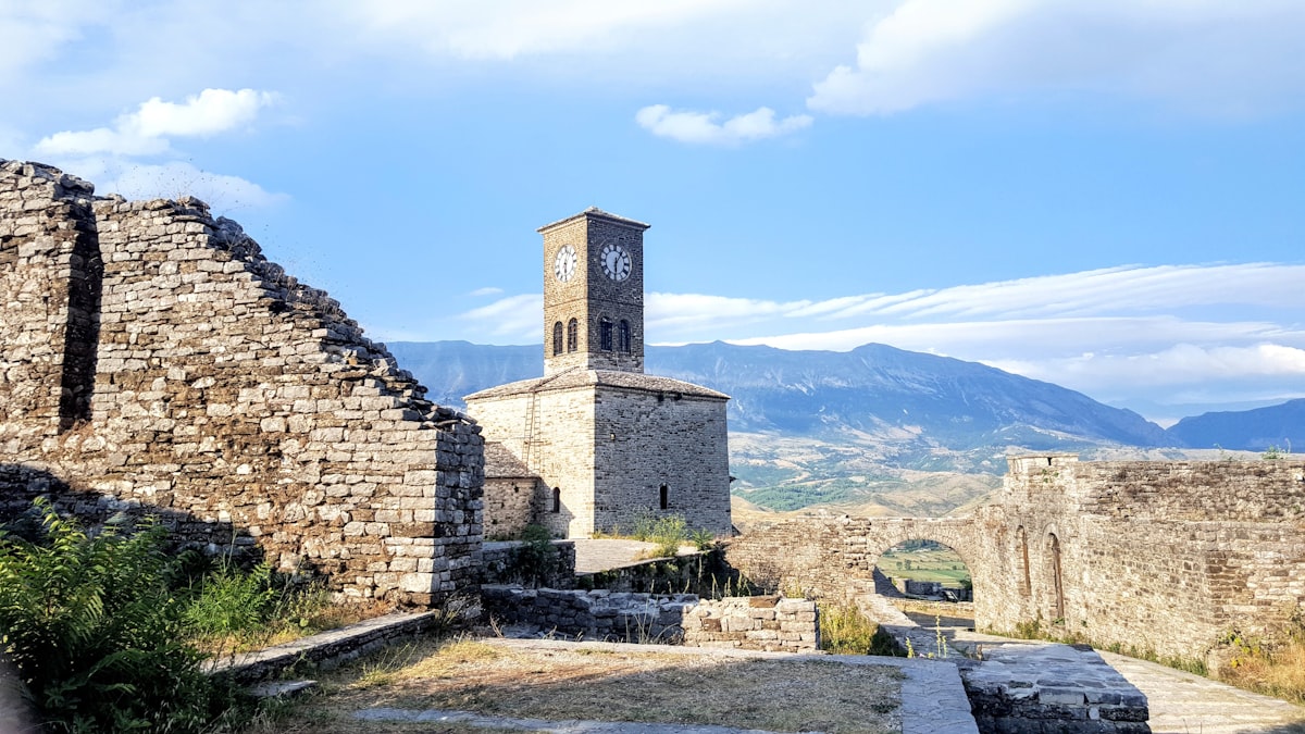 Stone architecture against the Albanian mountains
