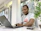 man in white and red crew neck t-shirt using laptop computer