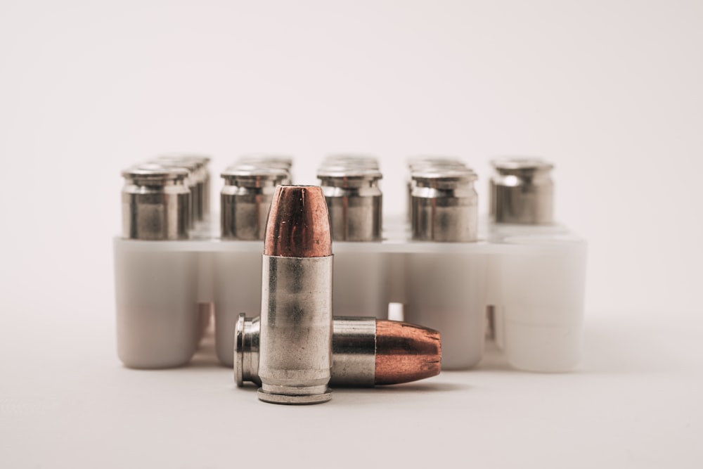 white and brown bottles on white table