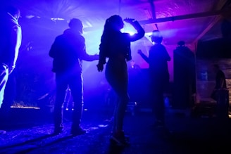 silhouette of people standing on stage