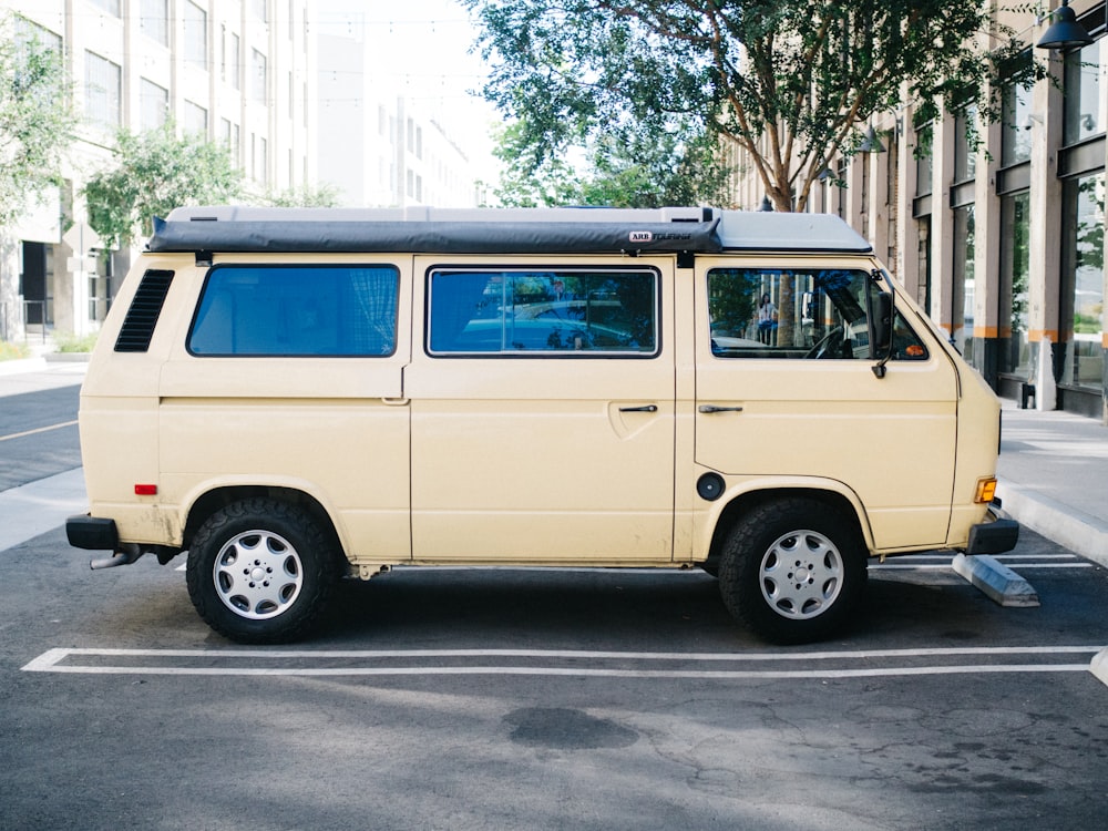 yellow van parked on the side of the road