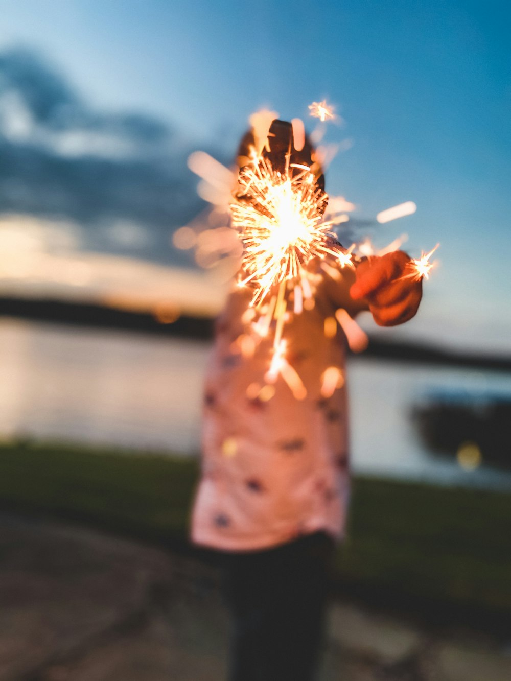 person holding white dandelion flower during daytime