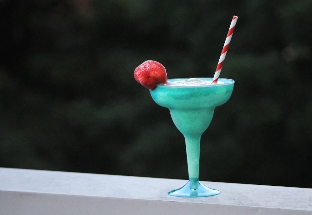 green ice cream in teal ceramic footed cup