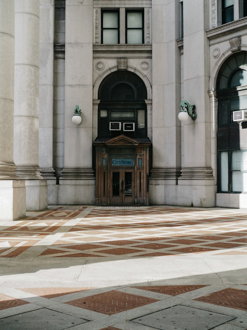 brown wooden door on gray concrete building