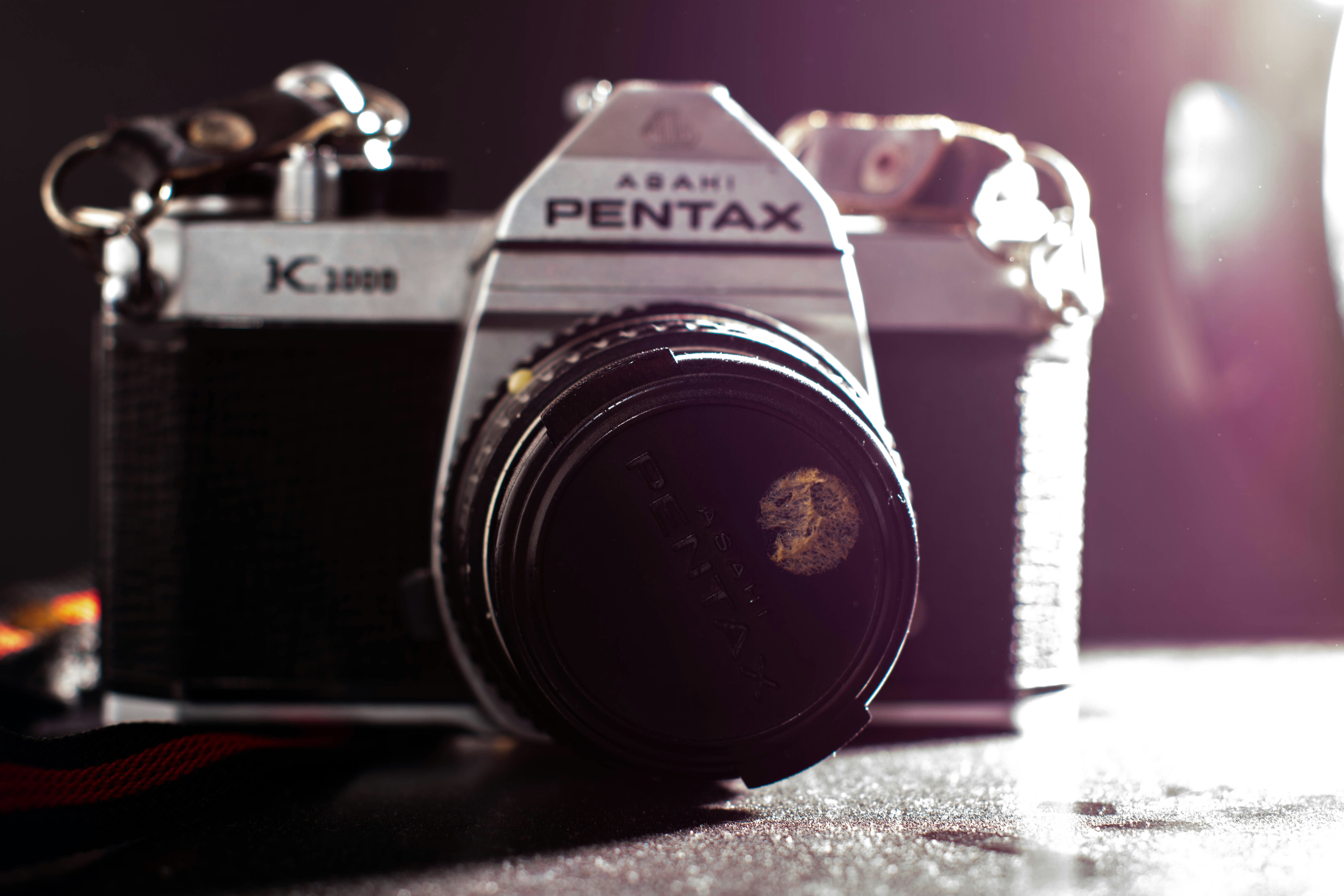 black and silver nikon dslr camera