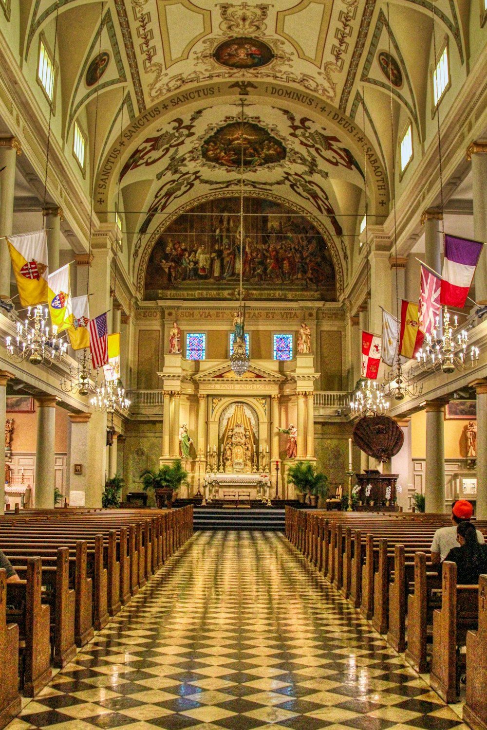 brown wooden chairs inside cathedral