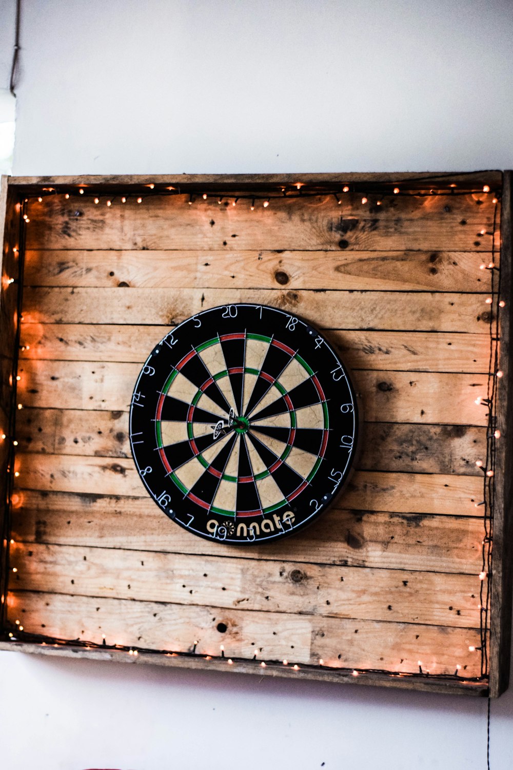 black white and red round analog wall clock