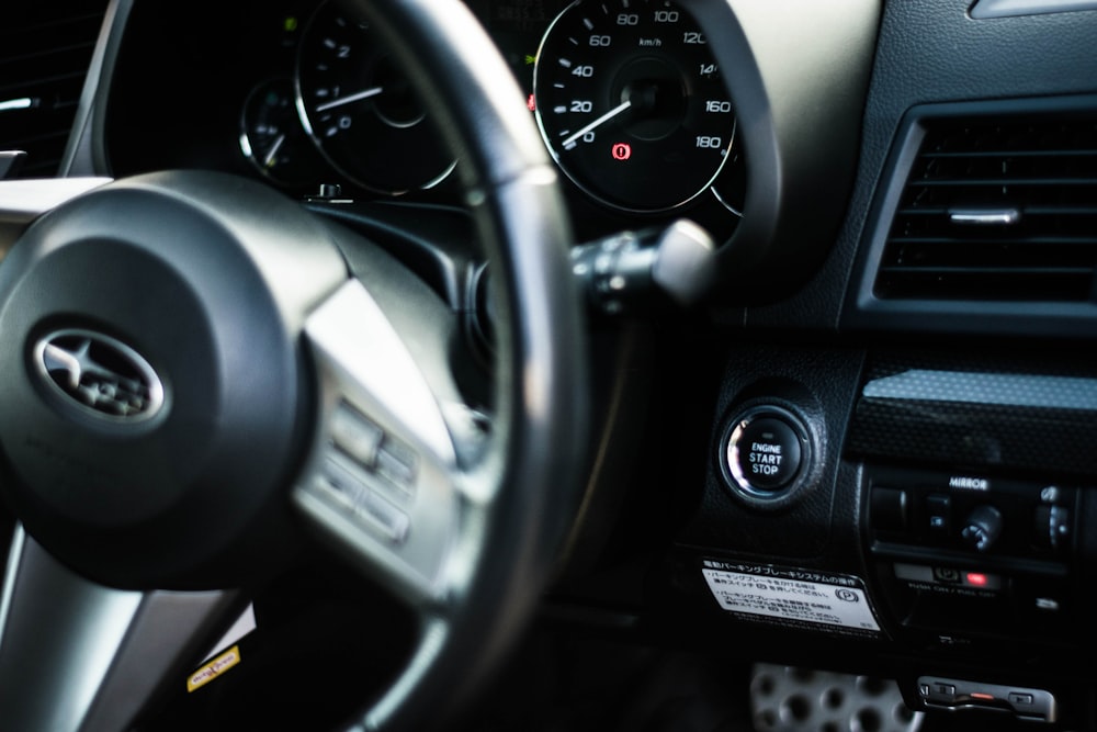 black and gray car steering wheel