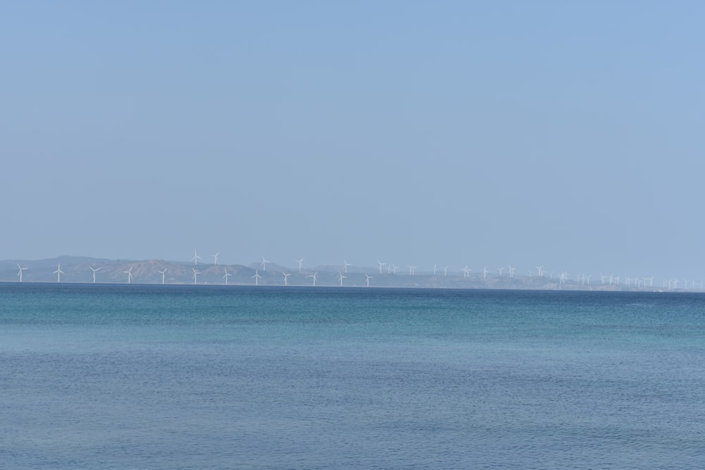 white bridge over the sea during daytime