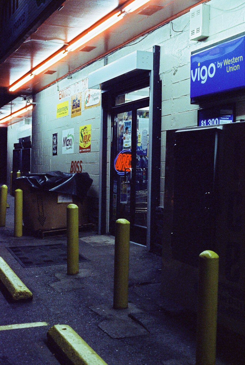 black wooden door near black and gray backpack