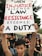 A young person holding a sign advocating for justice.