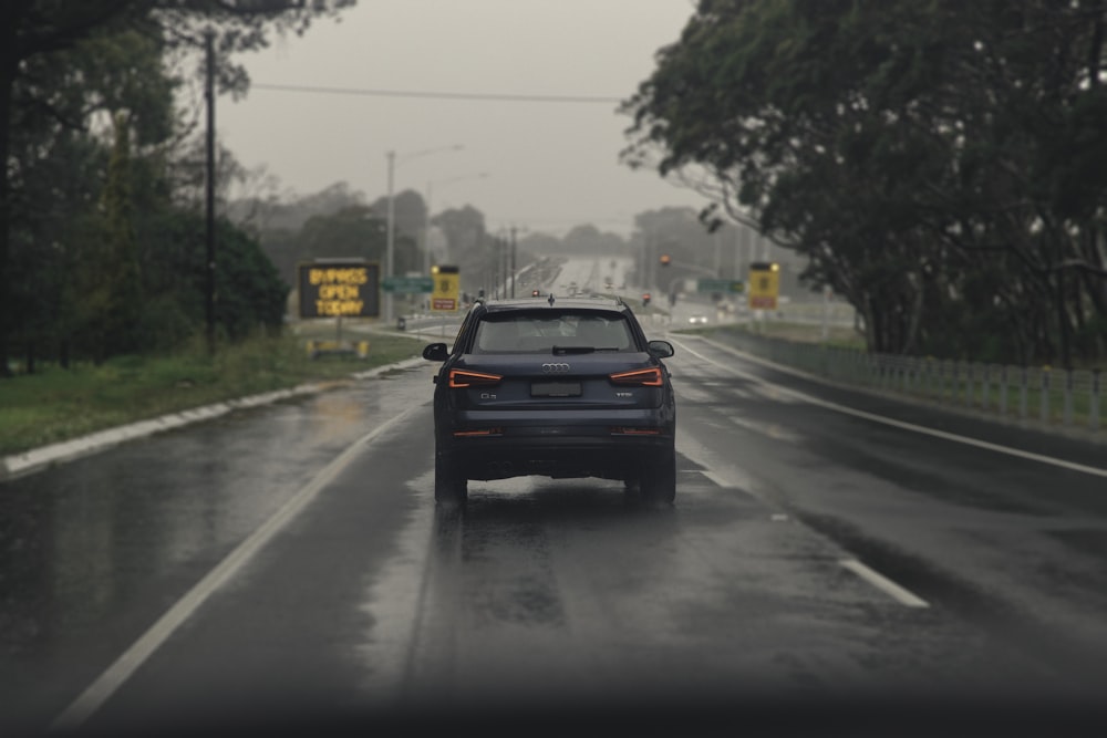 black car on road during daytime