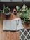 white book page beside green potted plant