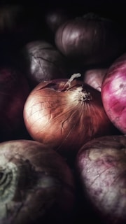 red round fruit on black surface