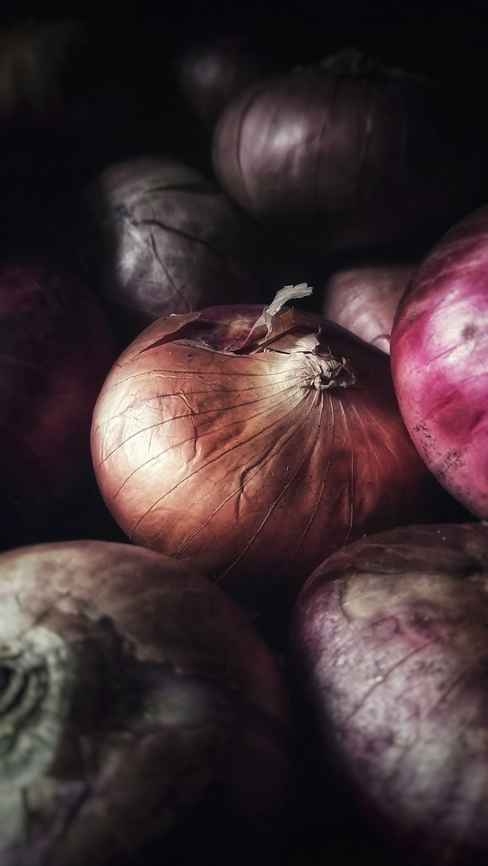 red round fruit on black surface