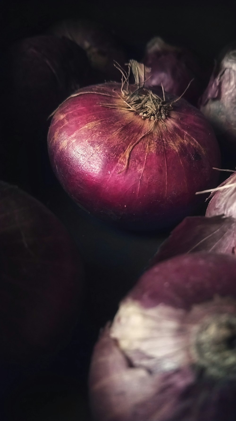 red onion on black surface