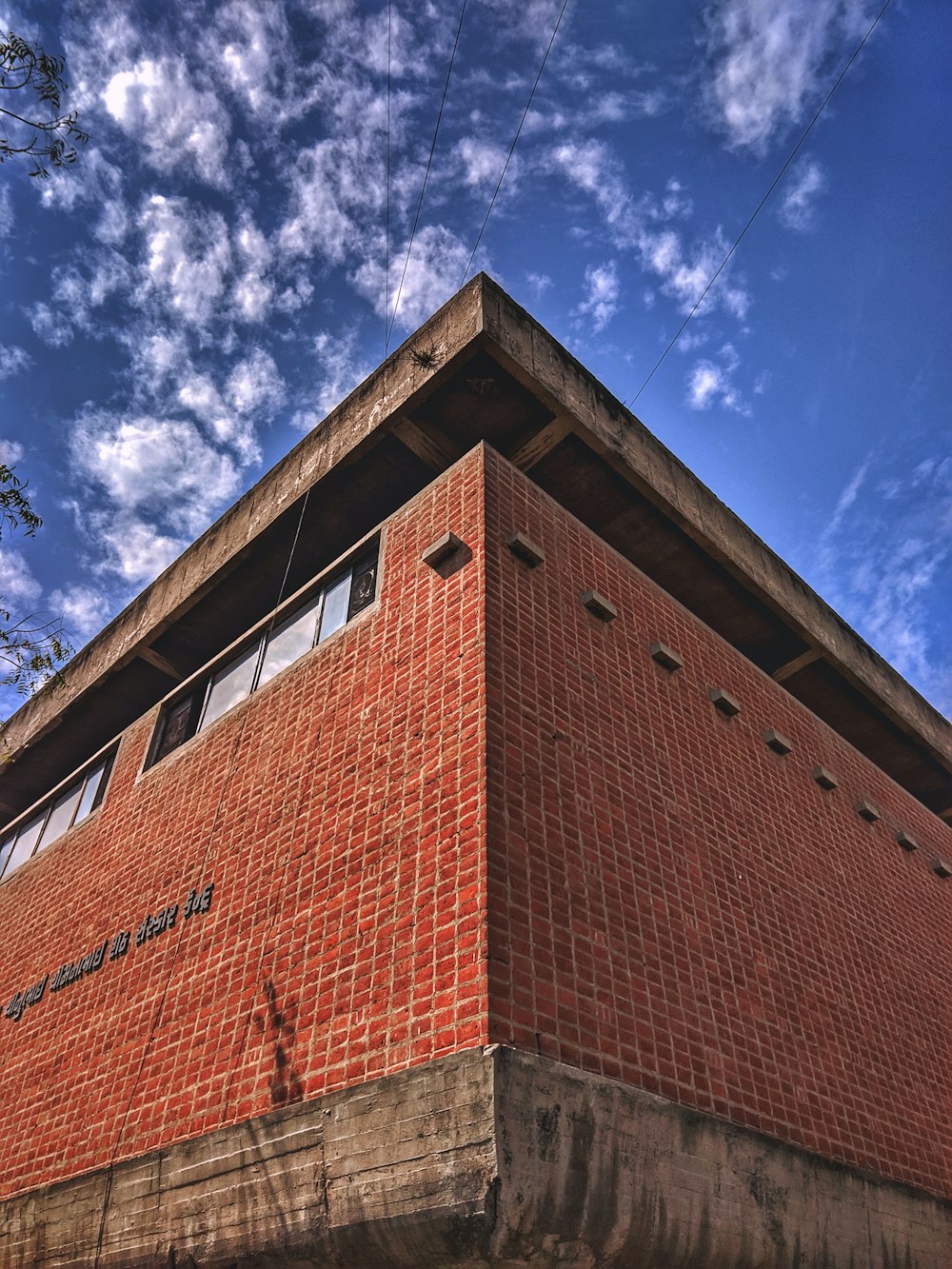 brown brick building under blue sky during daytime