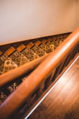 Elegant staircase with freshly painted wooden banisters in a warm tone.