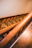 Close-up of a warmly stained wooden staircase with polished handrails inside a cozy home