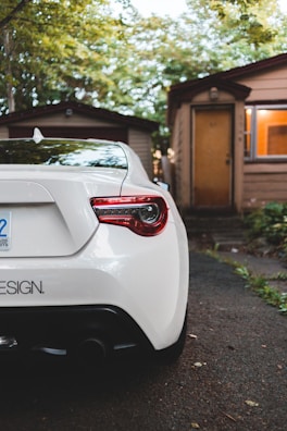 Car parked safely in a driveway, representing automobile insurance coverage.