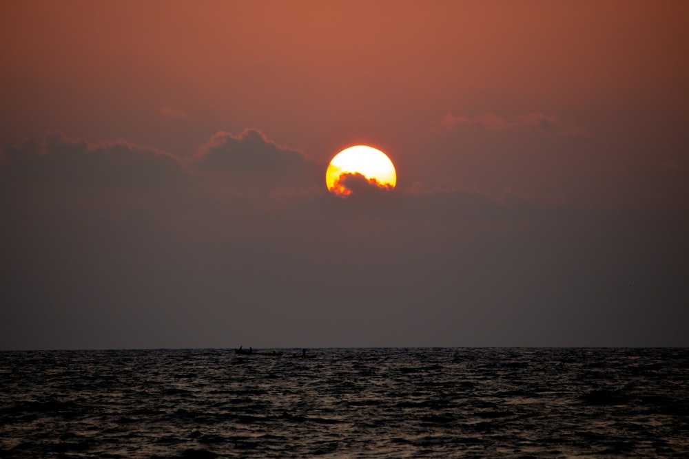 body of water during sunset