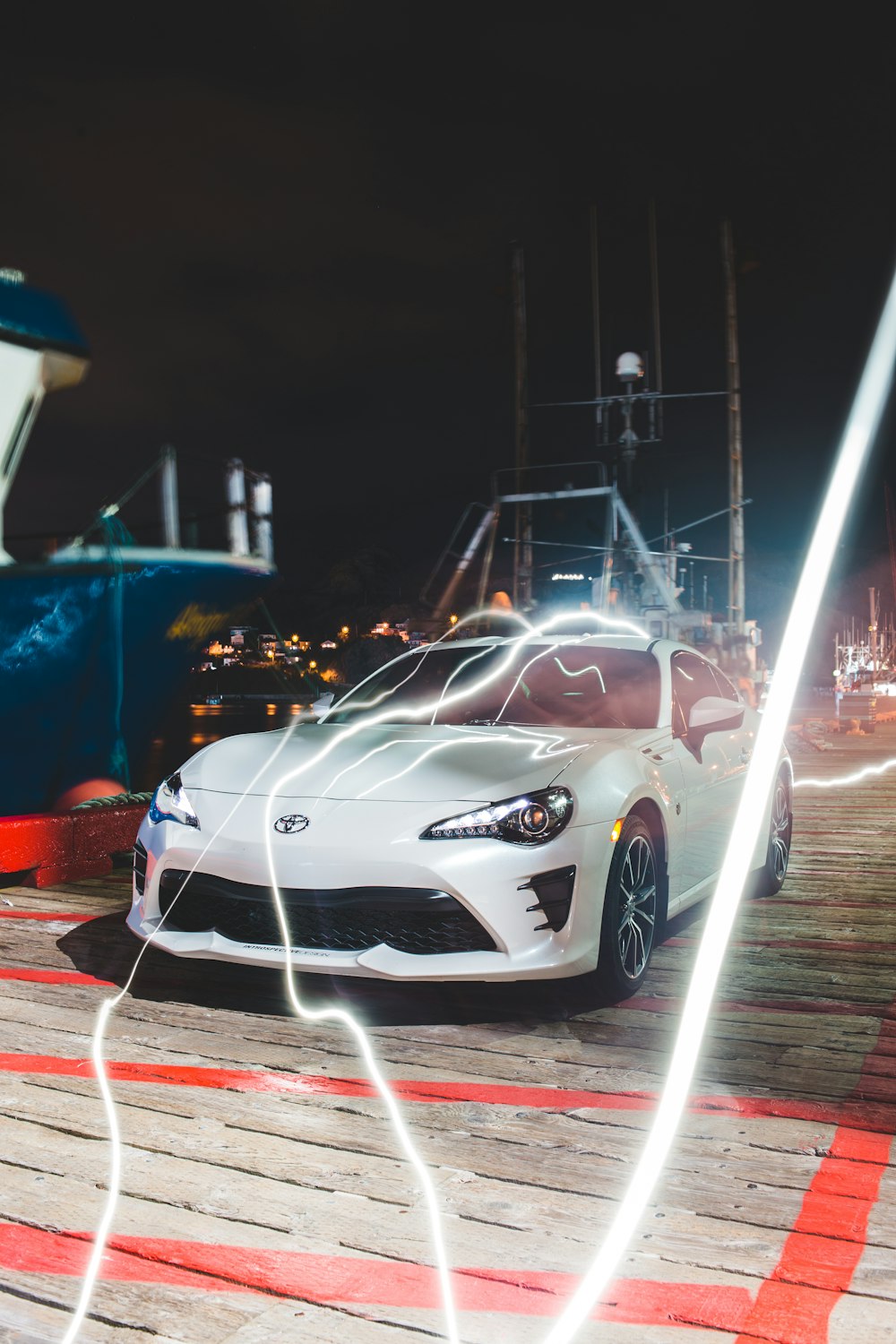 white porsche 911 on road during nighttime