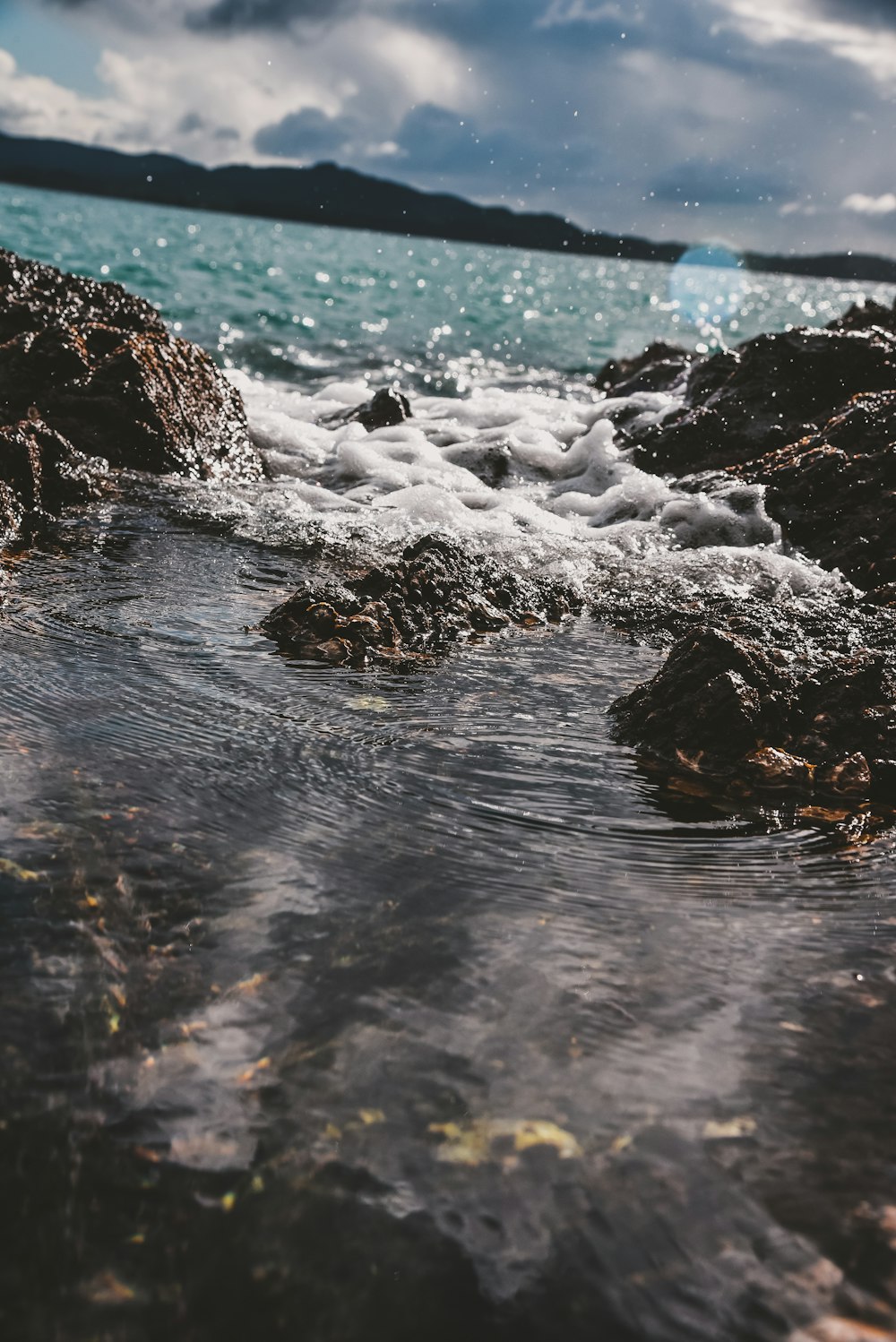 brown rocks on water during daytime