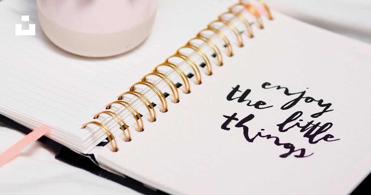 White spring notebook with green plant on white table photo – Free ...