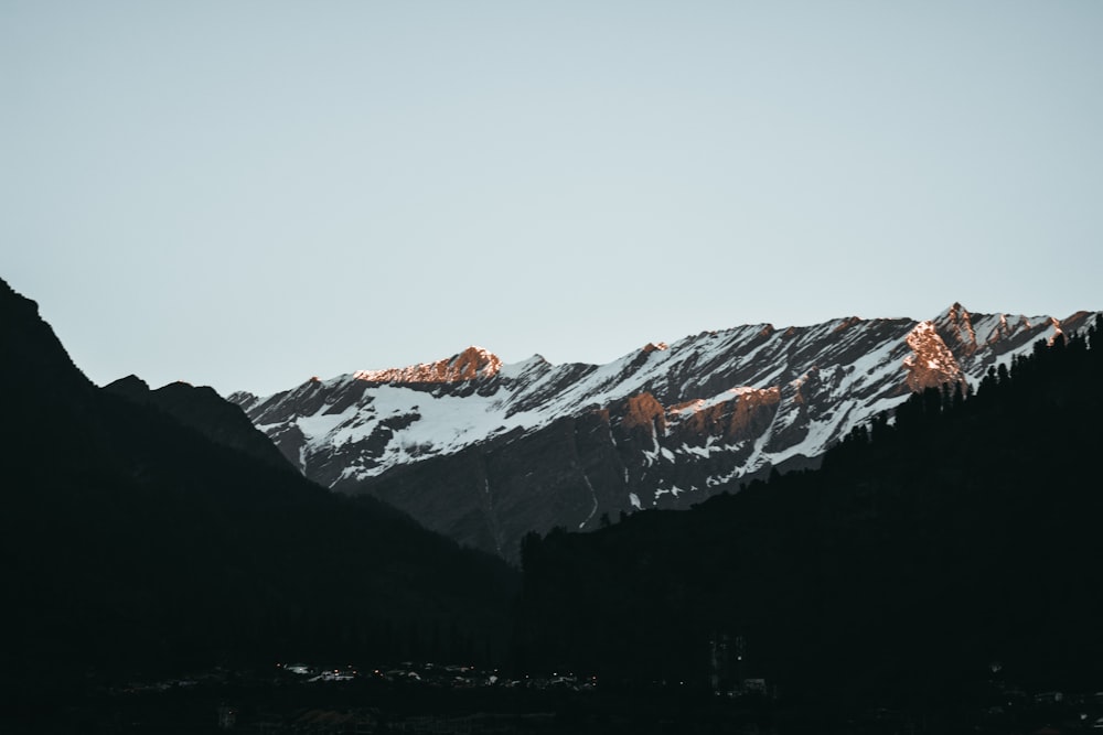 snow covered mountain during daytime