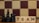 Wooden blocks with the word 'TEAM' are placed next to black chess pieces, including pawns and a king. The background features a blurred chessboard pattern with alternating light and dark squares.