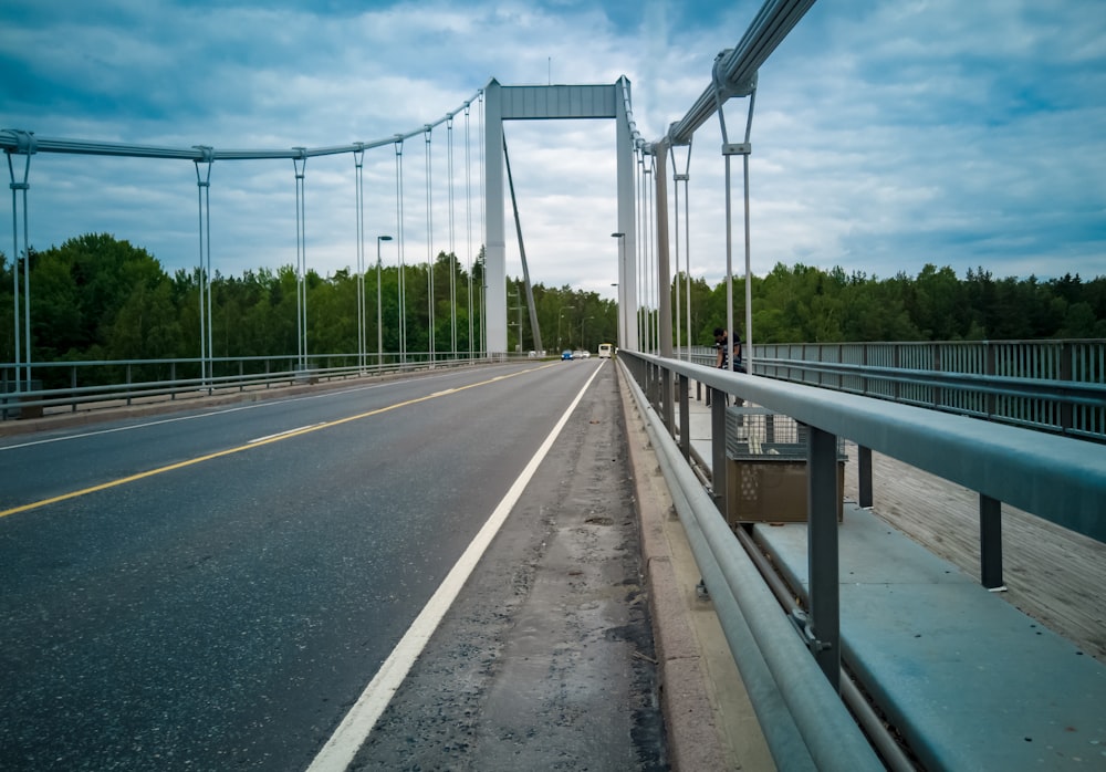 gray concrete bridge under white sky during daytime