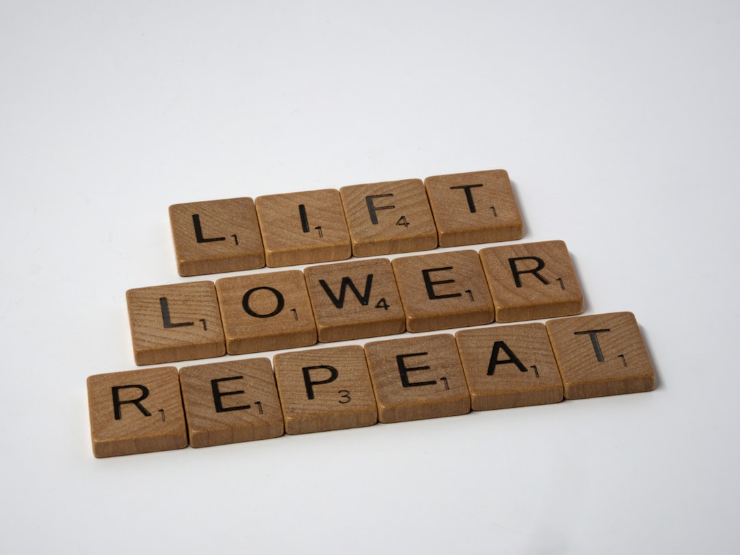 scrabble, scrabble pieces, lettering, letters, white background, wood, scrabble tiles, wood, words, lift, lower, repeat, weight training, pumping iron, fitness training, fitness, weights, barbell, dumbell, persistence, repetition, reps, 


