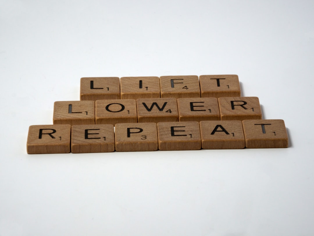 scrabble, scrabble pieces, lettering, letters, white background, wood, scrabble tiles, wood, words, lift, lower, repeat, weight training, pumping iron, fitness training, fitness, weights, barbell, dumbell, persistence, repetition, reps, 

