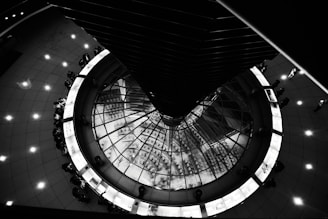 grayscale photo of spiral staircase