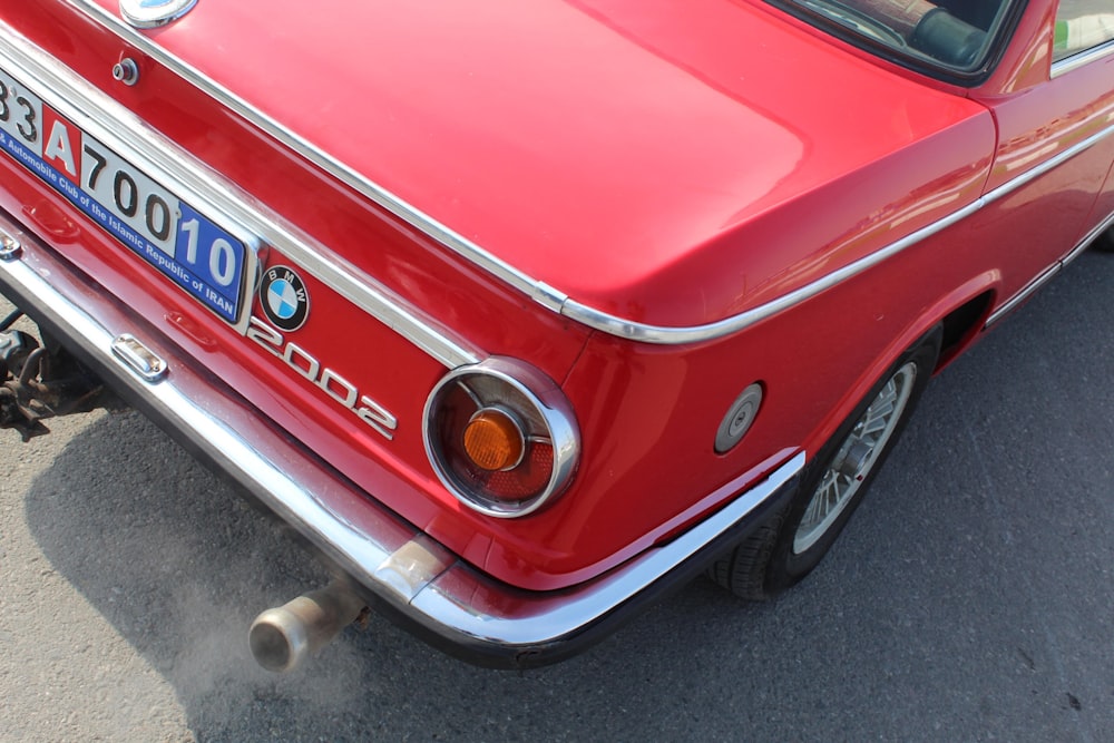 red ford mustang on gray asphalt road