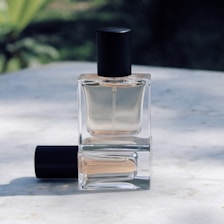 clear glass bottle on white table