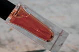 Close-up of a 250ml Awshal water bottle with pink label against a soft background.