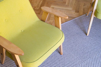 green padded brown wooden chair
