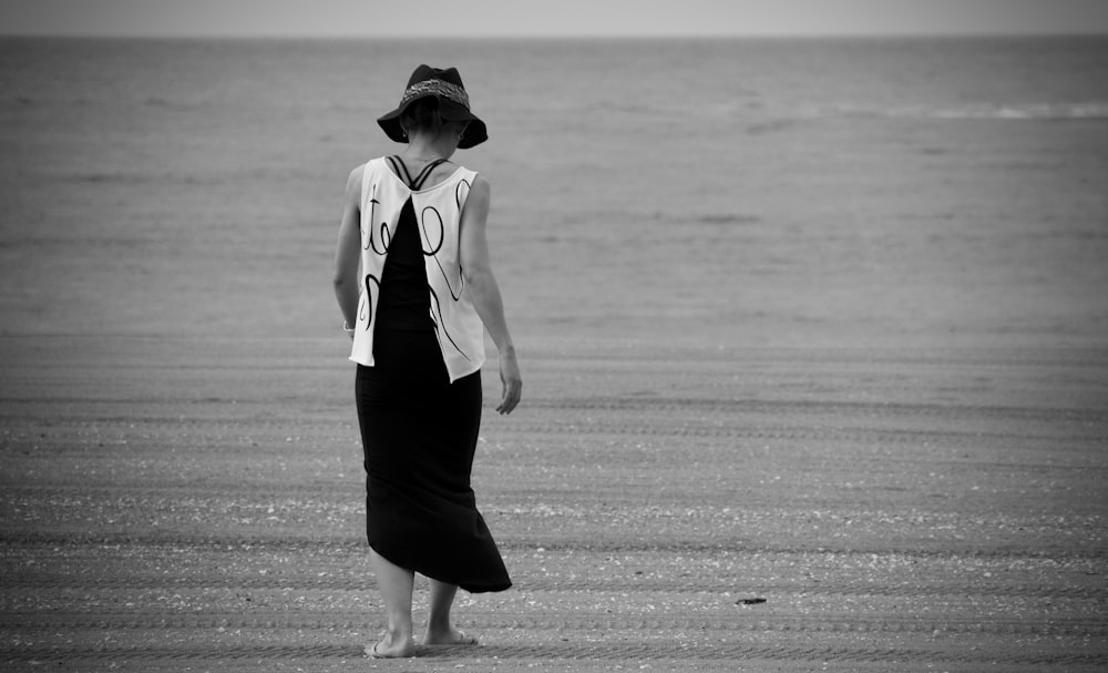 woman in black skirt and white shirt standing on the field